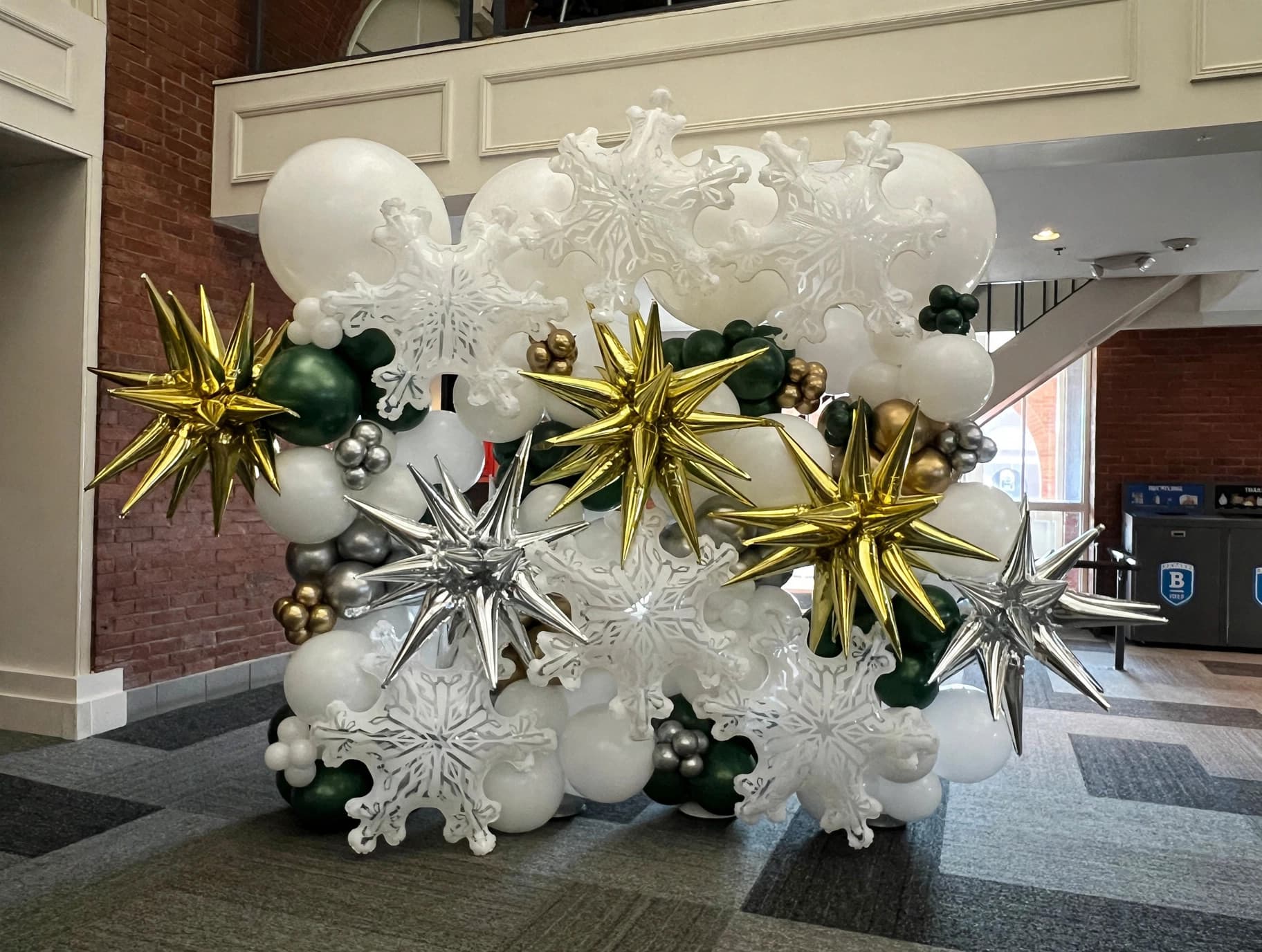 Winter-themed white snowflake starburst balloon wall