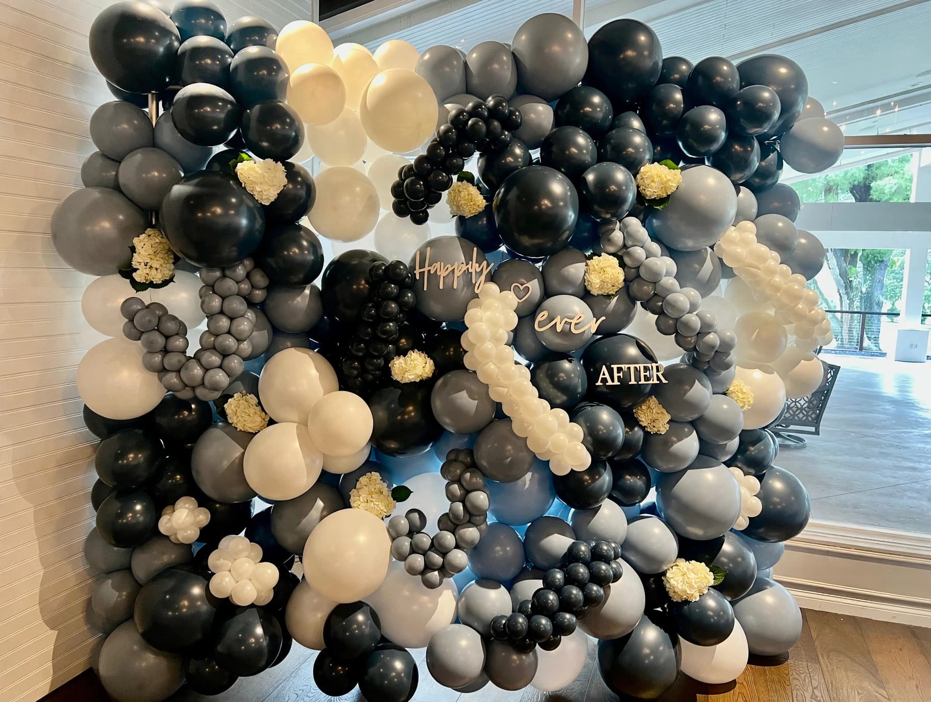 Elegant Happily Ever After balloon wall for a wedding reception